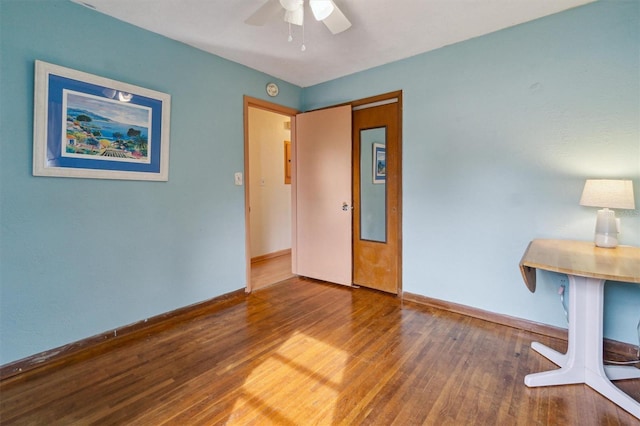 spare room featuring ceiling fan and wood-type flooring