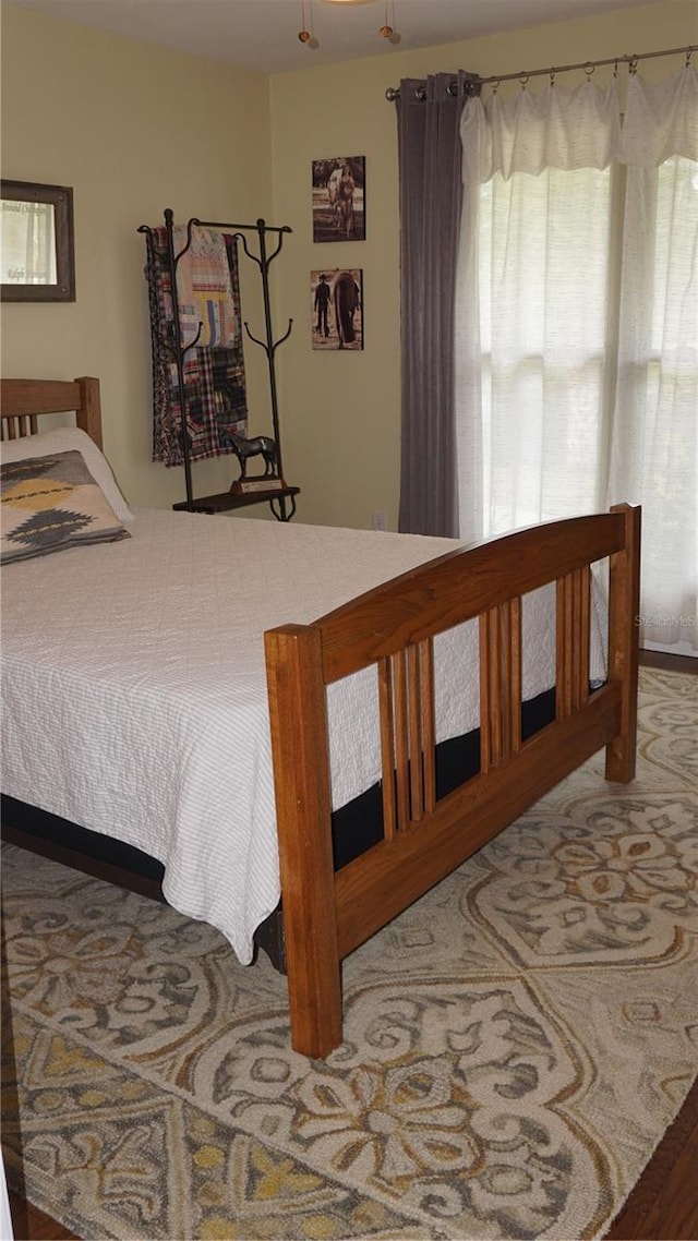 bedroom featuring hardwood / wood-style flooring