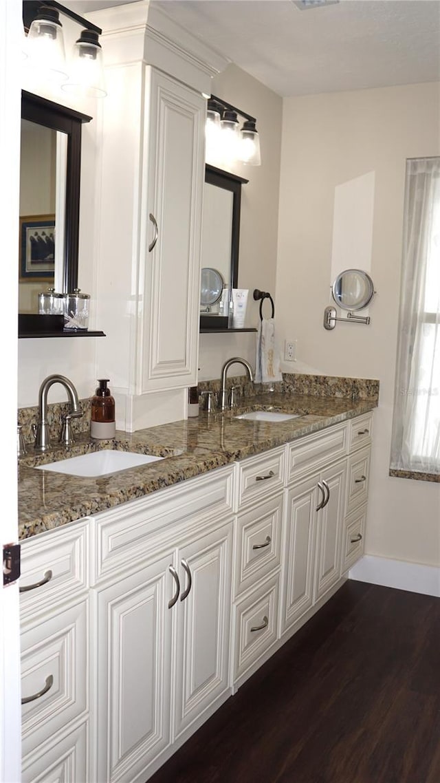 bathroom featuring wood-type flooring and vanity