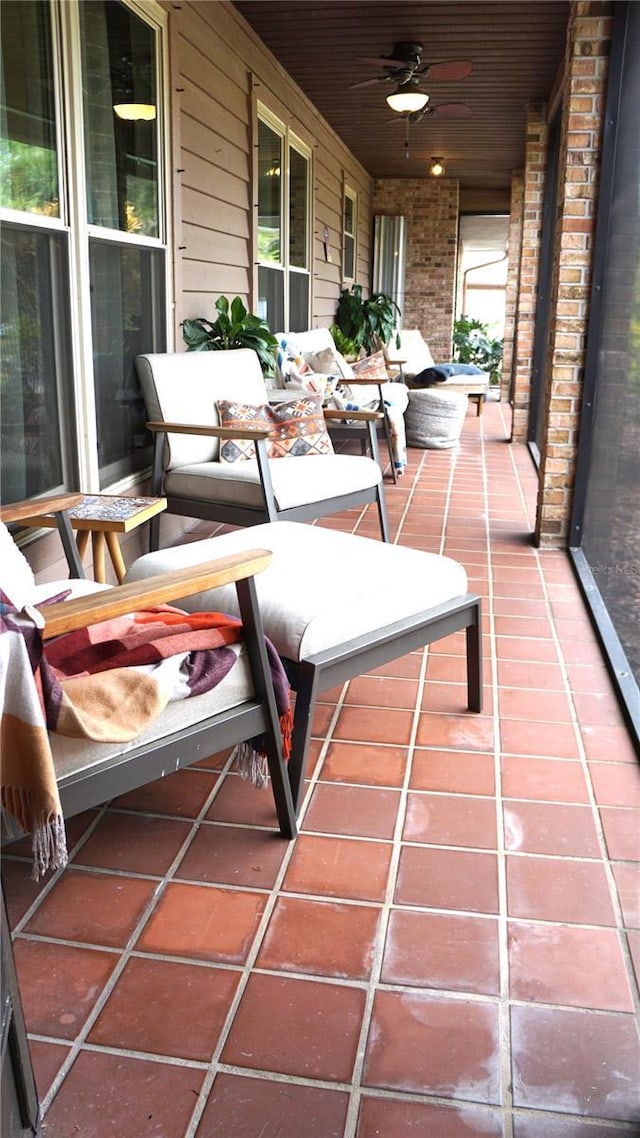 balcony with covered porch and ceiling fan