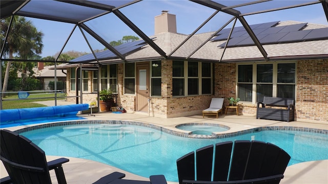 view of swimming pool with a patio area and an in ground hot tub