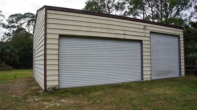 garage featuring a yard