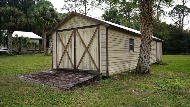 view of outdoor structure with a yard