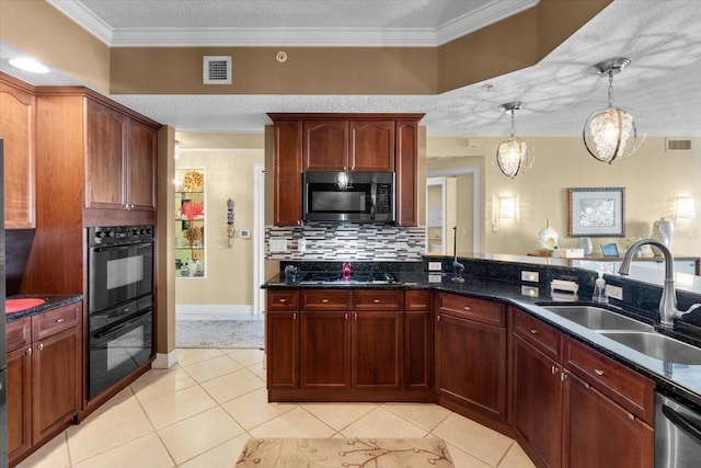 kitchen featuring light tile patterned flooring, decorative light fixtures, sink, black appliances, and crown molding