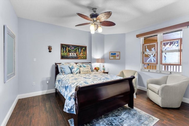 bedroom with dark wood-type flooring and ceiling fan