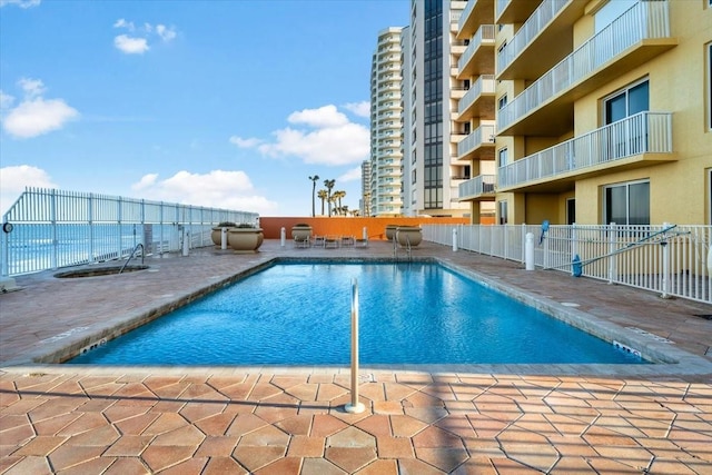 view of swimming pool with a patio area