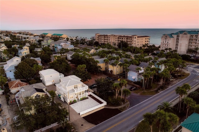 aerial view at dusk with a water view