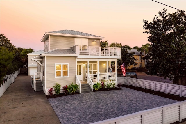 view of front of home with a balcony