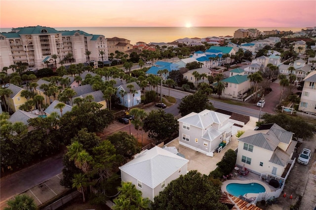 aerial view at dusk with a water view