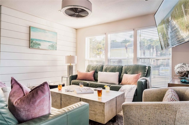 living room featuring wooden walls