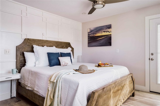 bedroom with ceiling fan and light hardwood / wood-style floors