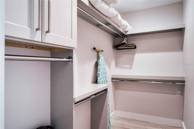 spacious closet featuring light wood-type flooring