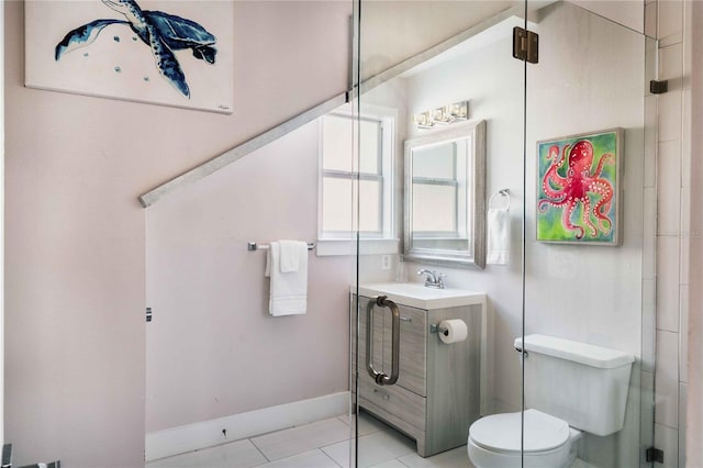 bathroom featuring vanity, toilet, and tile patterned flooring