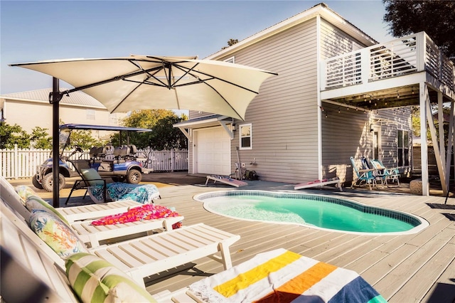 view of swimming pool with a wooden deck