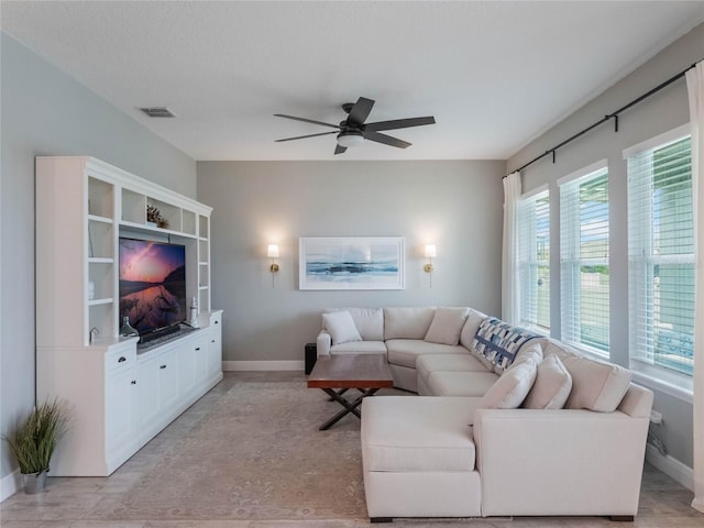 living room with ceiling fan