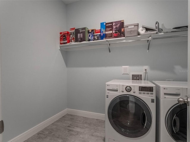 washroom featuring independent washer and dryer