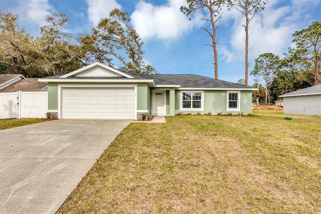 ranch-style house featuring a front lawn and a garage