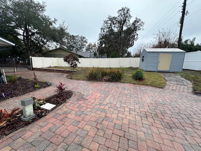 view of patio with a storage unit