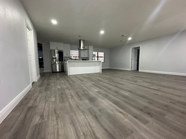 unfurnished living room featuring hardwood / wood-style floors