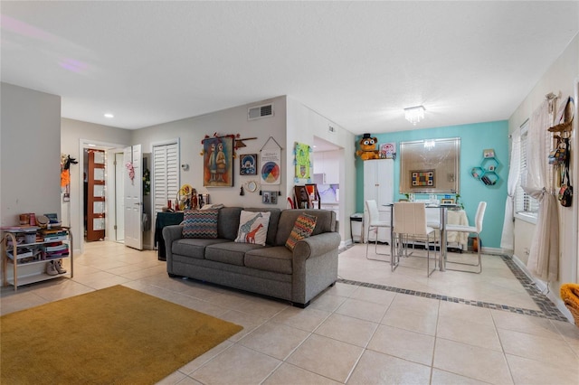 living room with light tile patterned flooring