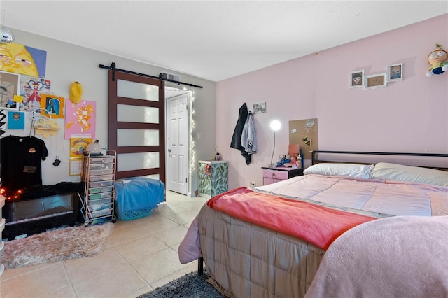 tiled bedroom with a barn door