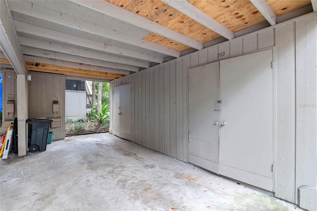 garage featuring wooden walls