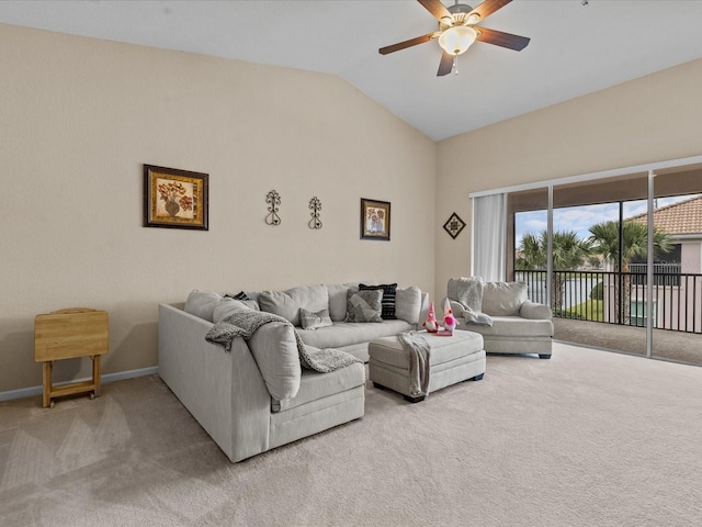 living room with vaulted ceiling, light colored carpet, and ceiling fan