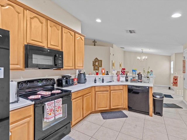 kitchen featuring light tile patterned floors, light brown cabinetry, and black appliances