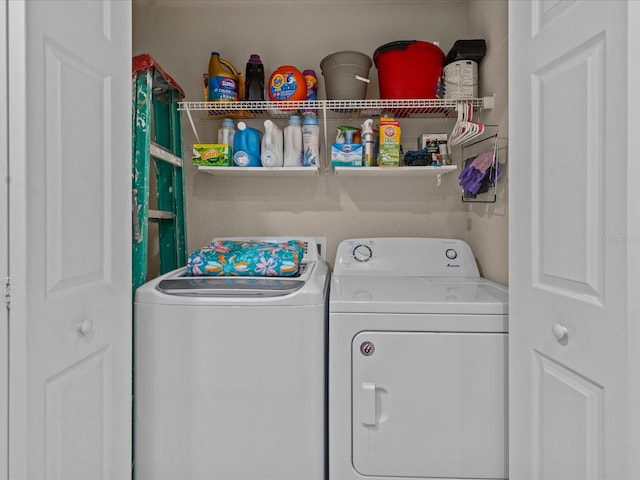 clothes washing area featuring separate washer and dryer