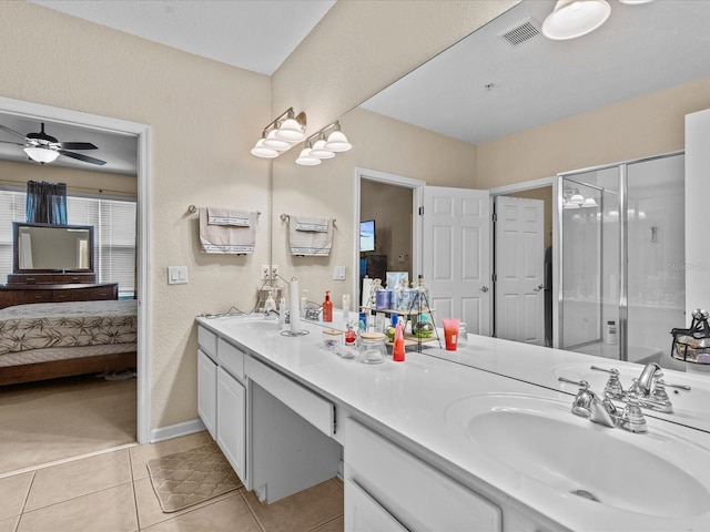 bathroom with vanity, tile patterned floors, ceiling fan, and walk in shower