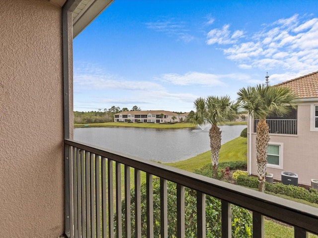 balcony with a water view and central AC unit