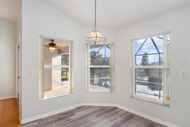 unfurnished dining area featuring a wealth of natural light and hardwood / wood-style floors