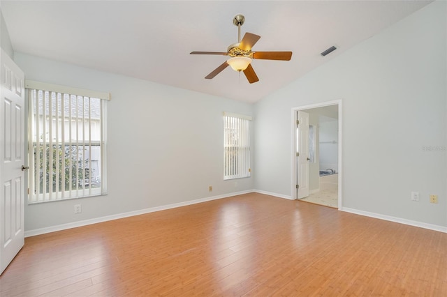 unfurnished room with light wood-type flooring, vaulted ceiling, and ceiling fan