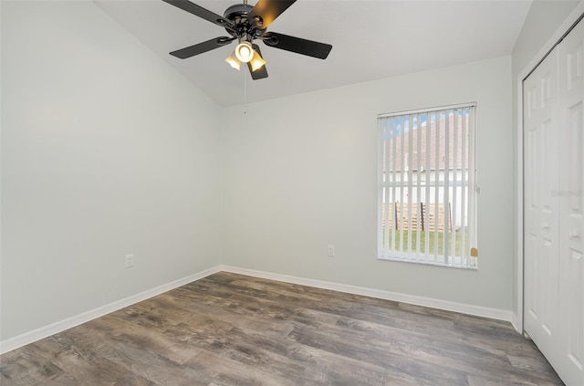 spare room with ceiling fan and wood-type flooring