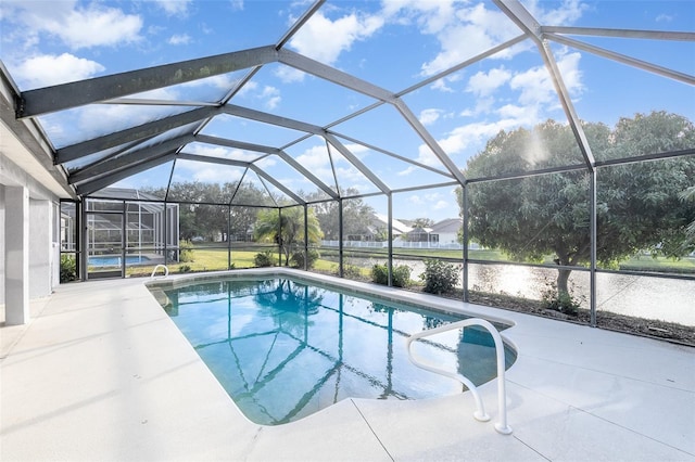 view of pool featuring a patio and glass enclosure