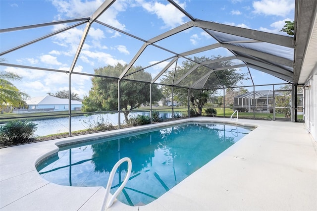 view of swimming pool with a lanai, a patio area, and a water view