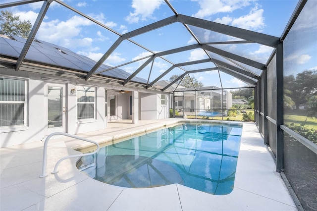 view of pool with a lanai and a patio