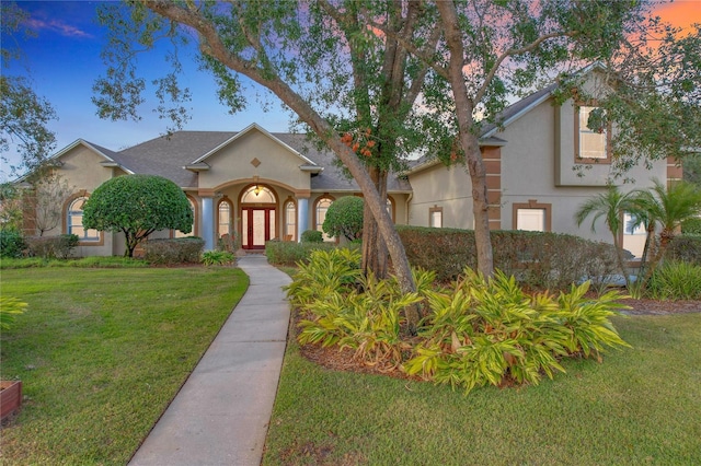 view of front of home with a yard