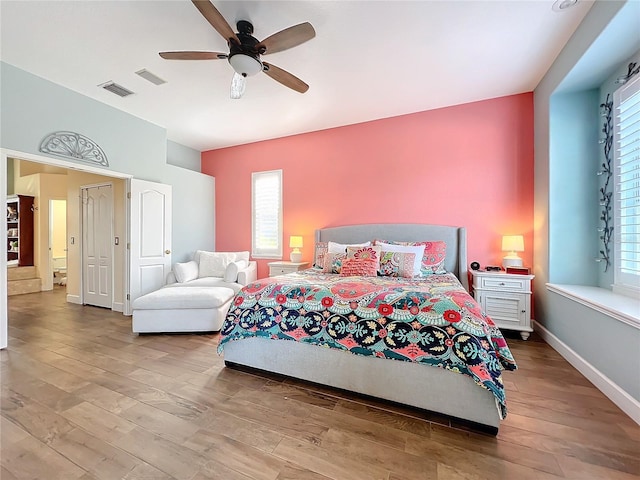 bedroom featuring ceiling fan and light hardwood / wood-style flooring