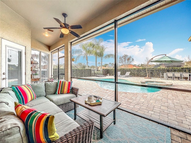 sunroom with ceiling fan