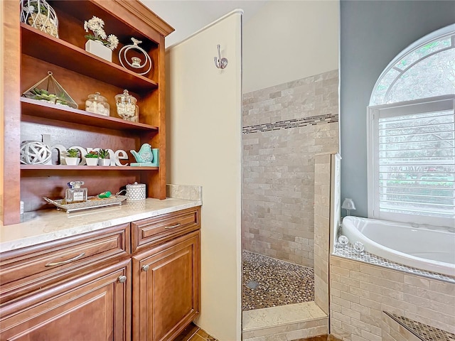 bathroom with shower with separate bathtub