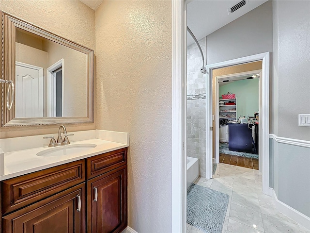 bathroom with vanity and shower / bath combination