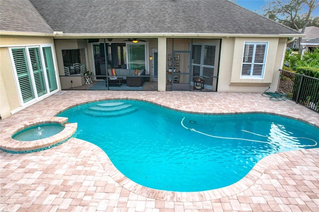 view of swimming pool with an in ground hot tub, outdoor lounge area, and a patio