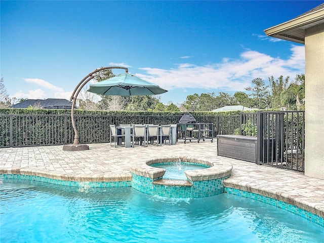 view of swimming pool with a patio area, a bar, and an in ground hot tub