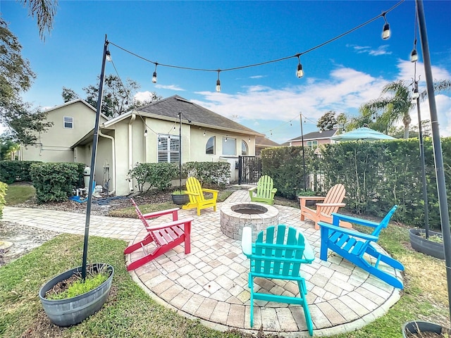 view of patio / terrace with an outdoor fire pit