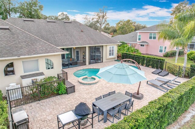 278 Eaglet Way, Lake Mary, FL 32746 - view of pool featuring a patio, a pool with connected hot tub, outdoor dining space, and a sunroom