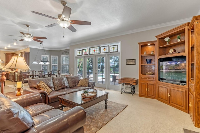 living room with crown molding, ceiling fan, a textured ceiling, light carpet, and french doors