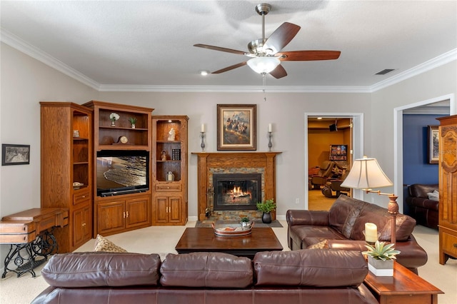 carpeted living room featuring ornamental molding and ceiling fan