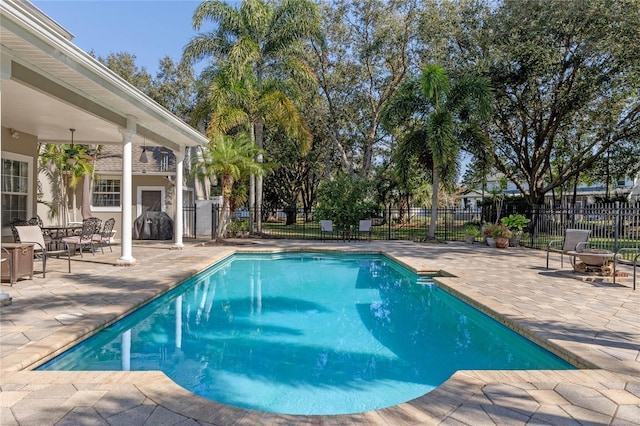 view of pool featuring a patio area