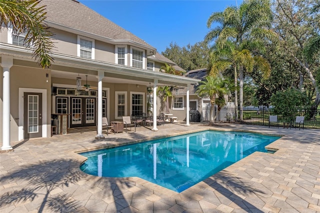 view of pool featuring a patio area, french doors, and ceiling fan